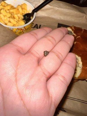 A ROCK I DID NOT ASK FOR IN MY CHICKEN SANDWICH YUMMMM THANKS