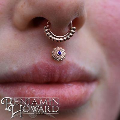 Philtrum piercing by Benjamin Howard.