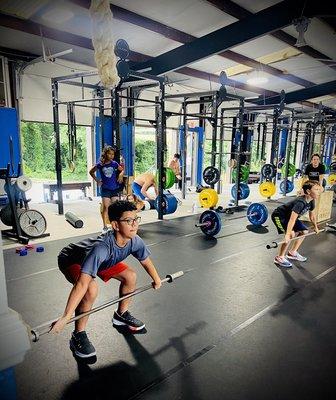 Kids learning Olympic lifts