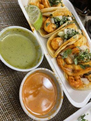 Shrimp tacos and salsas.