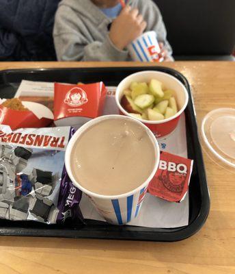 2, 4 piece chicken nuggets kids meal with apple slices and a small frosty with a toy and sprite.