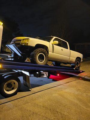 4 x 4 truck being towed.