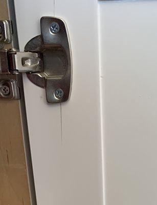 cracked inside cabinet on both hinges