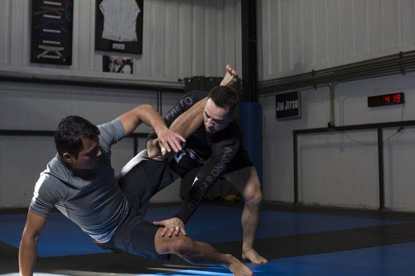 Coach Tony showing a guard pass in Jiu Jitsu