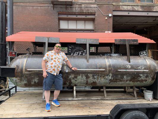 Me in front of the Smoker. There's another behind this one. Heavy AF doors!