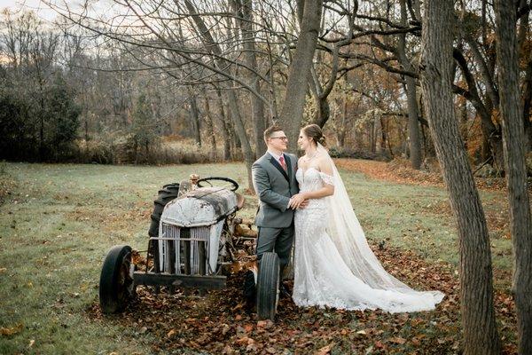 Tender moment at our farm tractor during a farm wedding