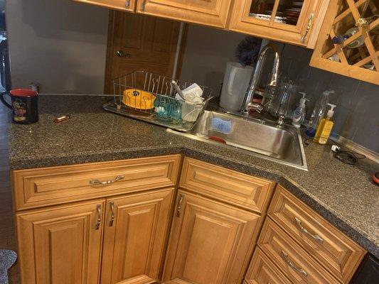 The kitchen before the new countertops and cabinets painted