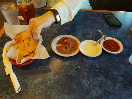 Chips, salsa, hot cheese and refried beans to start our lunch