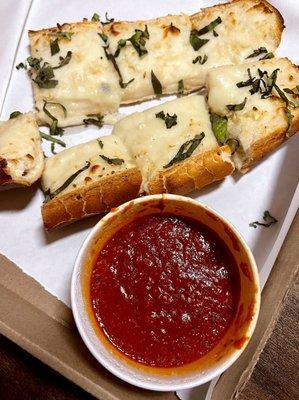 12" Garlic bread with cheese nice touch with basil on top came with marinara sauce