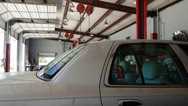 Inside of garage sitting at the waiting bench.