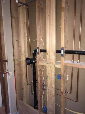 Hot / cold waters, drain and vent pipes and condensation drain lines installed for basement rec room 22 of 57