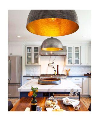 Marble kitchen with oversized lights.  Your local independent tile store!