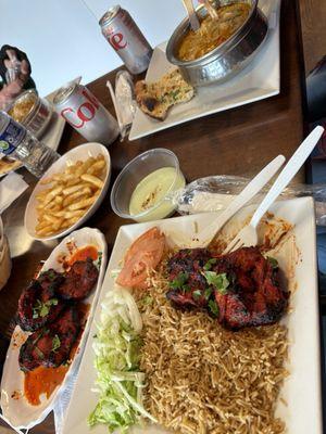 Chicken Tikka Boti on the lower half of the photo and a kettle of White Chicken Karahi on the upper half.