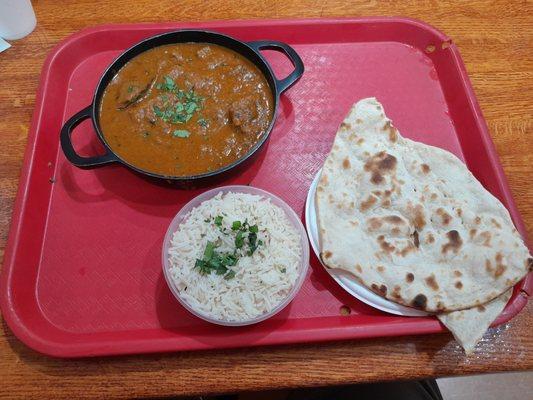 Curried lamb and rice.  Naan is extra charge.