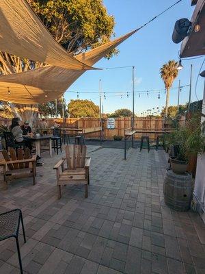 Outdoor patio with cornhole