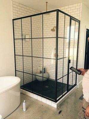 Gridscape style ninety degree shower enclosure.