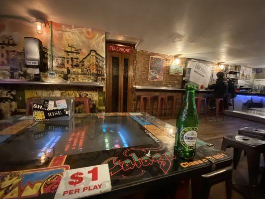 Dining area. Sit at arcade game table or stool.