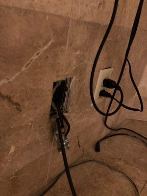 Cable connection, falling out of a marble surround.