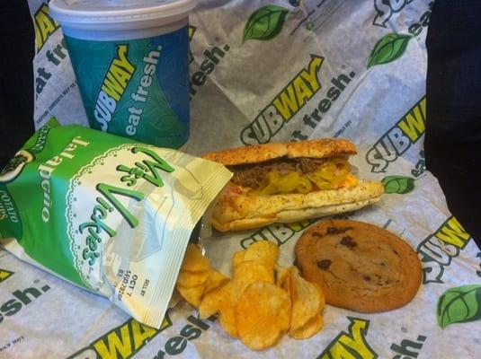 Steak & cheese sub, jalapeño chips, and a chocolate chip cookie