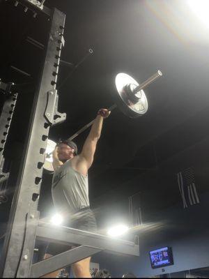 Squat rack with bumper plates