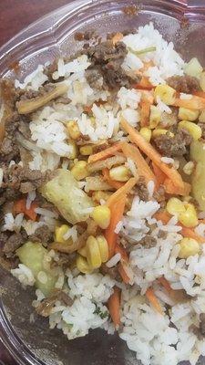 Bulgogi bowl with lime cilantro rice, mixed vegetables and onions, corn, cucumber.