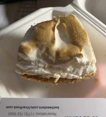 Lemon meringue pie slice $6.99 and smaller than a business card.