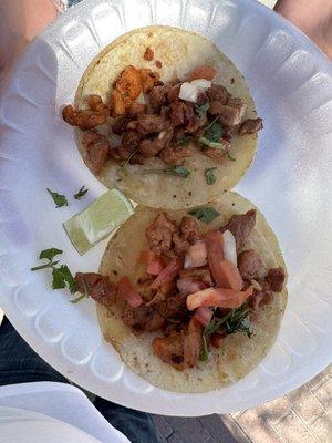 Two Al Pastor tacos, fixed up from the salsa bar