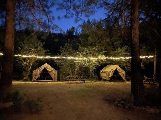 Amazing riverside tents with cots and a fire pit