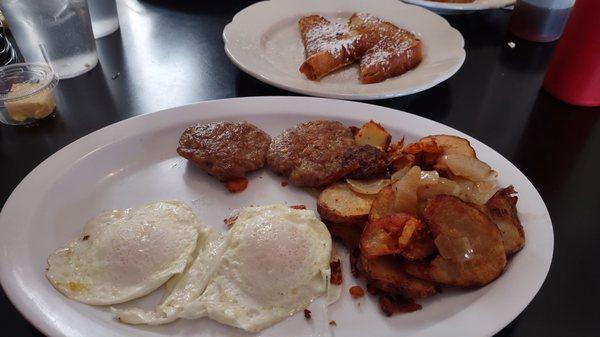 Queen Street Special - two easy over, crispy potatoes with onion, sausage, & French toast.