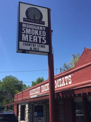 The sign and familiar barn red building.