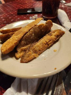 Fried in chicken grease. Awesome potato wedges.