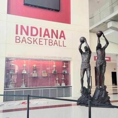 Basketball player statues located inside front entrance to the left