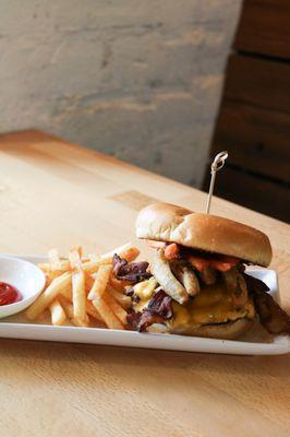 Southern Charmer - Double Patty, American Cheese, Bacon, Fried Pickles, Sweet Potato Fries and Spicy BBQ sauce