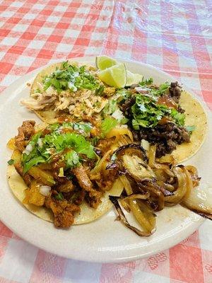 Pollo, asada and Al pastor taco