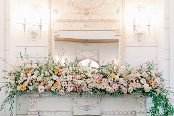 Mantle arrangement by Trophy Blooms.