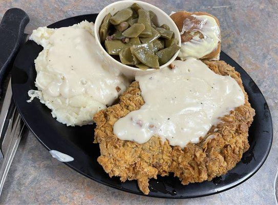 Chicken fried steak with mash potatoes and green beans