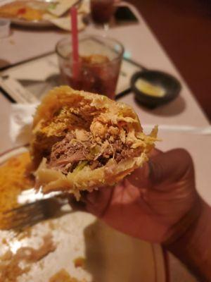 Inside this delicious fried burrito...chicken and steak