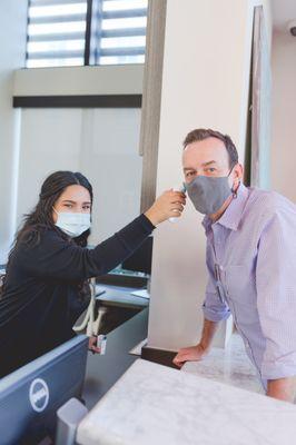 Temperature checks and face masks are required for all staff and patients