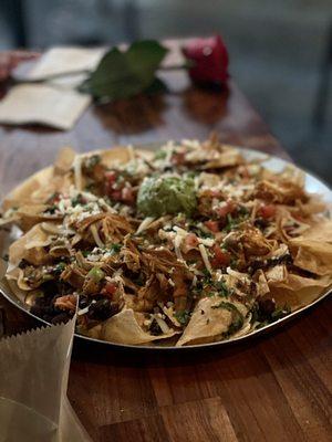 El jefe nachos with chicken-$12. Huge portion, a little cold, but absolutely delicious...and a rose from zaddy....