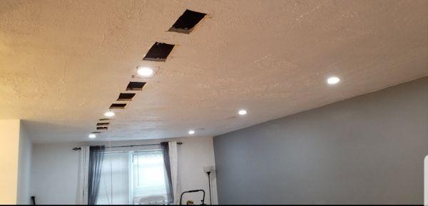 Condo in NYC recessed lighting installed on existing ceiling.