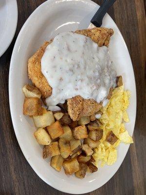 Chicken fried chicken, sausage gravy,scrambled eggs, potato's