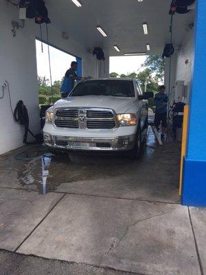 Men hard at work, no mops here they hand wash roof