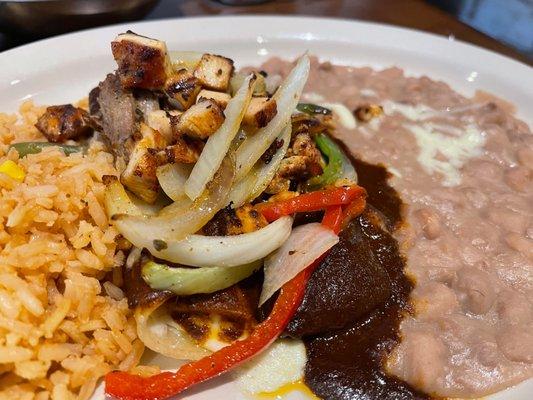 I don't remember exactly what this is. Seem like it was enchiladas with Mole, chicken and grilled vegetables on top! It was outstanding!