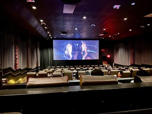 View from Auditorium 2, Row K, Seat 11. Reclining leather seats with swivel tables