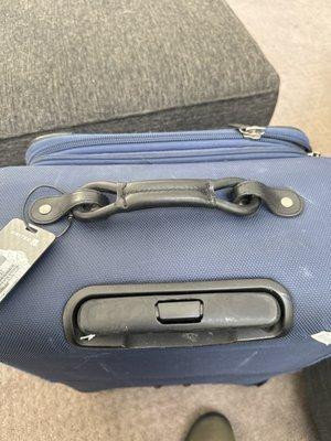 Repaired luggage handle.