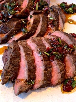 Rancher steak with preserved tomatoes and onion sauce.