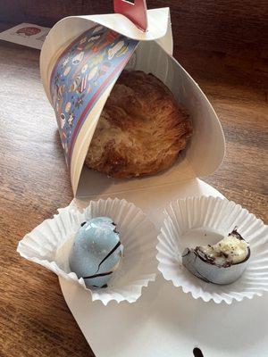 Kouign Amann. Left blue chocolate is a plant-based coconut bonbon. Right is a vanilla bonbon. All delicious!