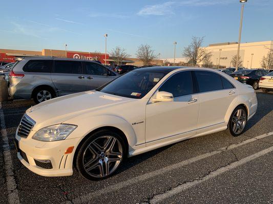 Glass windshield on a luxury sedan.