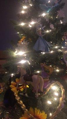 Around the tree, different parts are parts from different Disney movies