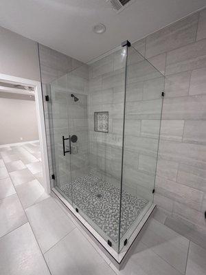 Bathroom remodel with new shower with frameless glass enclosure